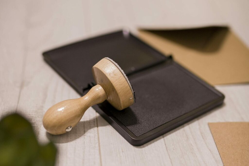 Wooden stamp on ink pad placed on desk